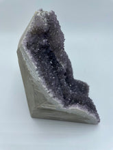Load image into Gallery viewer, Side view of the purple amethyst gemstone with the rock side on the left and the purple amethyst side on the right
